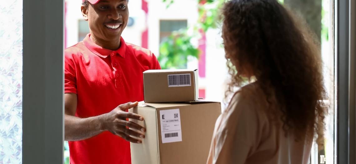 customer getting a package in a timely manner with a smile