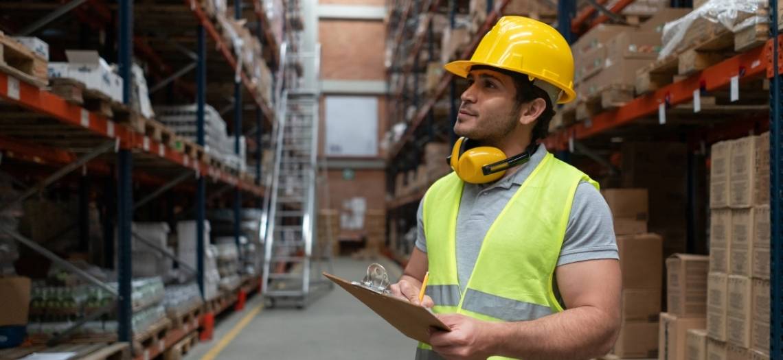 employee taking inventory in a warehouse